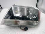 Driver Headlight Smoke Tint Dark Background Fits 02-04 Grand Cherokee 694832. Fixed Price $109.19.