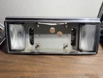 89-93 Cadillac Deville Fleetwood Backup Reverse Light License Plate Mount T1. Fixed Price $62.65.