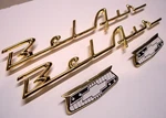 55 56 Chevy Belair Gold Quarter Panel Scripts Crest Emblems Complete Set. Fixed Price $89.95.