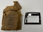 New Old Stock License Lamp Bezel For 1949-53 Models Mopar #1244779. Fixed Price $145.00.