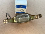 Corvette Rear License Plate Light Lamp Assembly Gm Nos New 72 73. Fixed Price $144.00.