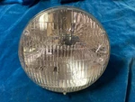 1949-1955 Ford, Thunderbird, Lincoln, Mercury Nos 6V Fomoco Headlight Bulb. Fixed Price $49.99.