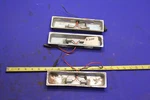 Lucas L743 License Plate Light Housings. Fixed Price $69.30.