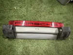 Porsche 911 Center Taillight Lens (with Black Letters) Mounted On Partial Bumper. Fixed Price $600.00.